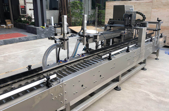 vullen olie emmer dop machine.jpg