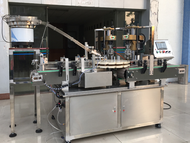 capping machine with 2 capping heads schroefdopmachine semi-automatisch.jpg