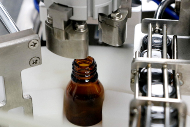 olie flessen vulmachine tafelblad.jpg